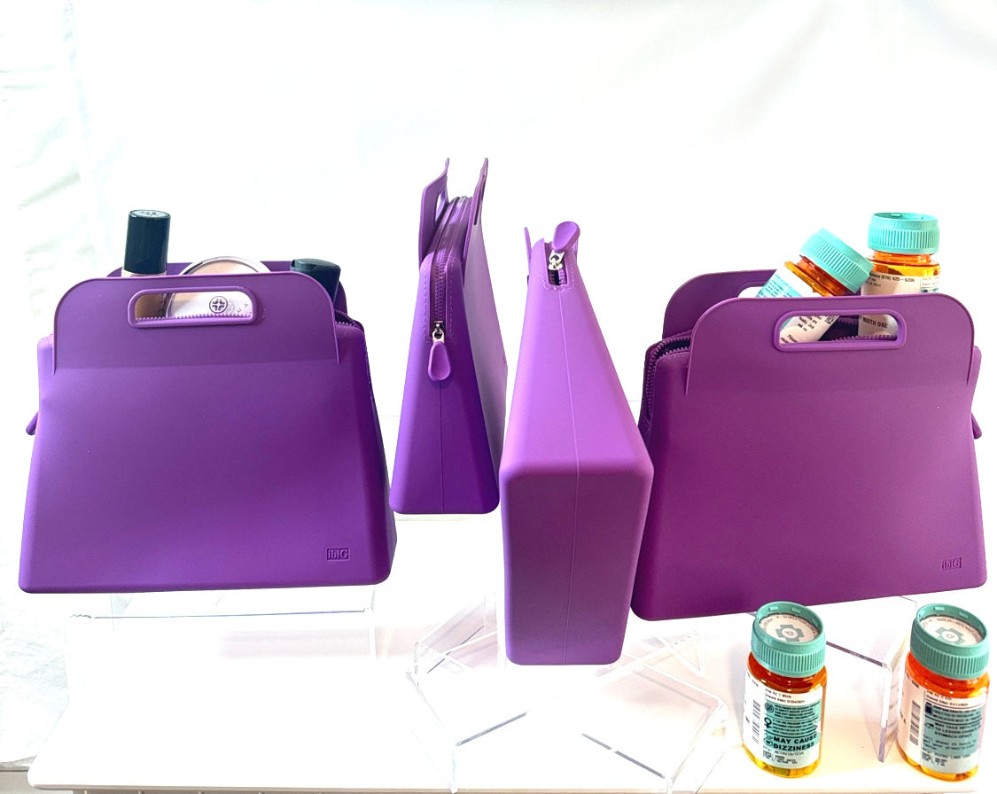 IMAGES OF 4 LARGE(GRANDE) IBIG SILICONE MAKEUP BAGS IN PURPLE,ARRANGED TO SHOW THE DIFFERENT SIDES,ONE BAG HAS MEDICATION BOTTLES IN AND IN FRONT OF IT ,ONE BAG HAS MAKEUP PRODUCTS IN IT. make up bags / toiletry bags / toiletry / toiletries / make up / make up case /Travel makeup bag / travelbag / travel bags for women / toiletry travel bag / travelbags / cosmetic bags/beauty bag/ makeup / makeup organizer